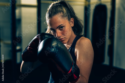 woman boxing posing with gloves