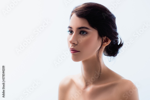 naked young woman looking away isolated on white