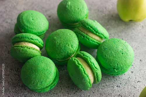 Macaroons. Delicious french desserts. Macaroons on the table. Macaroons with cream cheese and apples