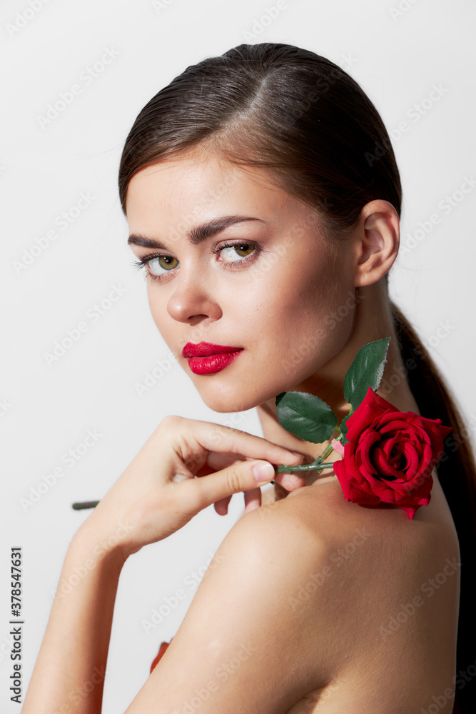 Woman with bare shoulders Charming look pure skin model red lips light Woman with bare shoulders Charming look pure skin model red lips light