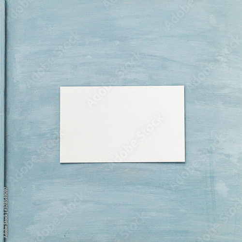 Vertical clean piece of paper on blue vintage painted board with lavender and tree cone © Ciprian