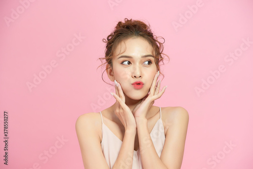 Woman with beautiful hairstyle over pink background photo