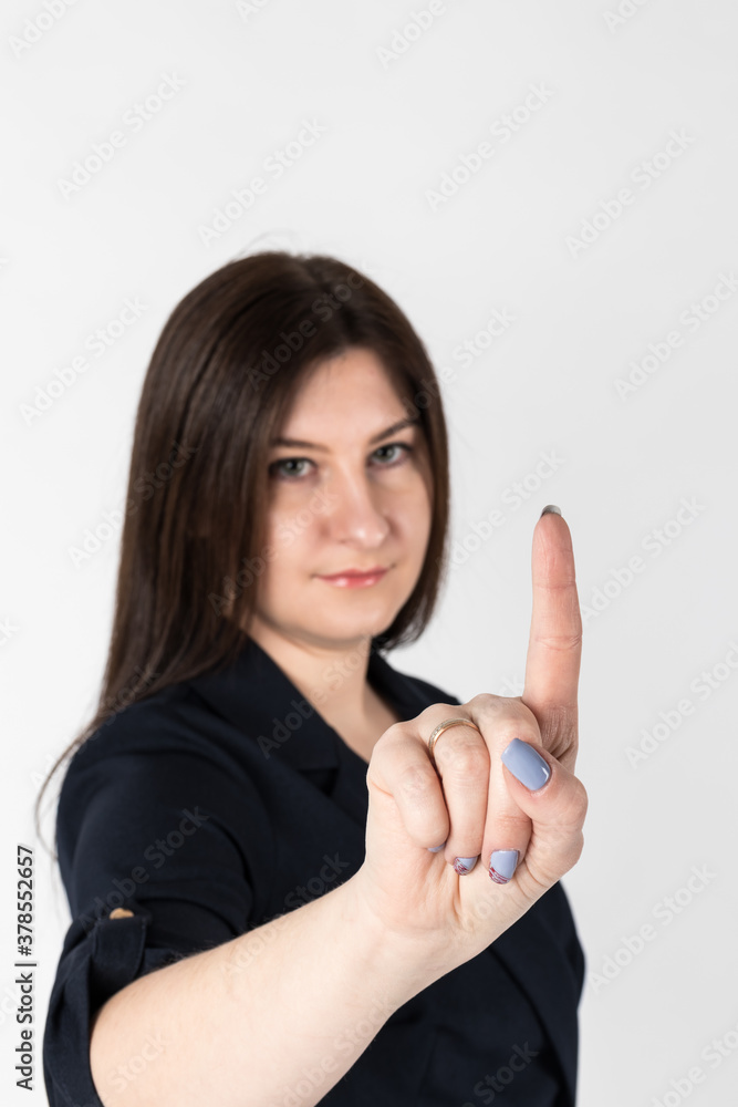 Young woman in blue is pushing the virtual button. Young woman in blue is pushing the virtual button.