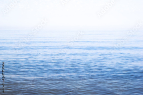 Dawn at the sea. Beautiful peep of morning. Blue natural background. Soft and calm. Copy space