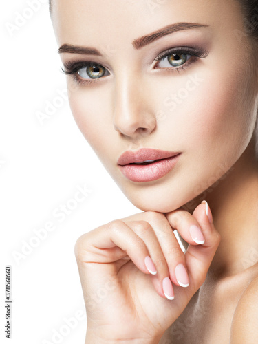 Beautiful face of young woman with health fresh skin
