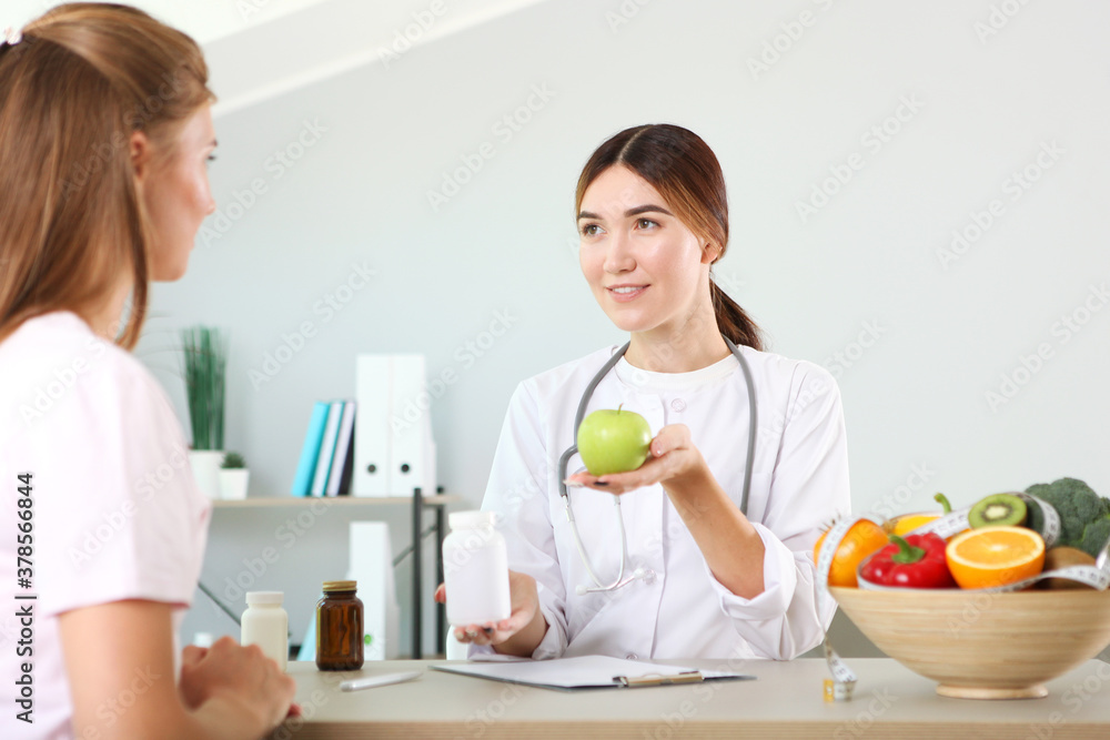 doctor nutritionist takes a patient in the office. proper nutrition, weight control