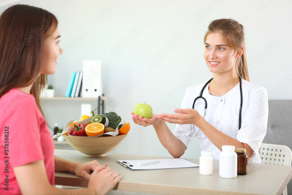 doctor nutritionist takes a patient in the office. proper nutrition, weight control