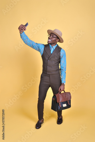 Young man take selfie from hands with phone.