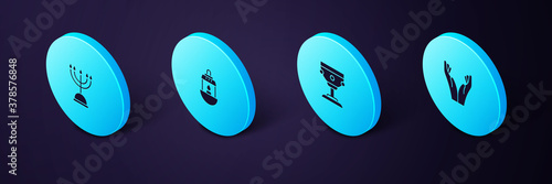 Set Isometric Hands in praying position, Christian chalice, Ramadan Kareem lantern and Hanukkah menorah icon. Vector.