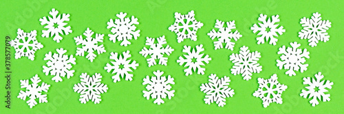 Wallpaper Mural Set Banner of white snowflakes on colorful background. Top view of Christmas ornament. New Year time concept with empty space for your design Torontodigital.ca