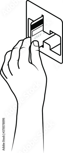 Hand holding a credit card inserting it into a card reading slot.
