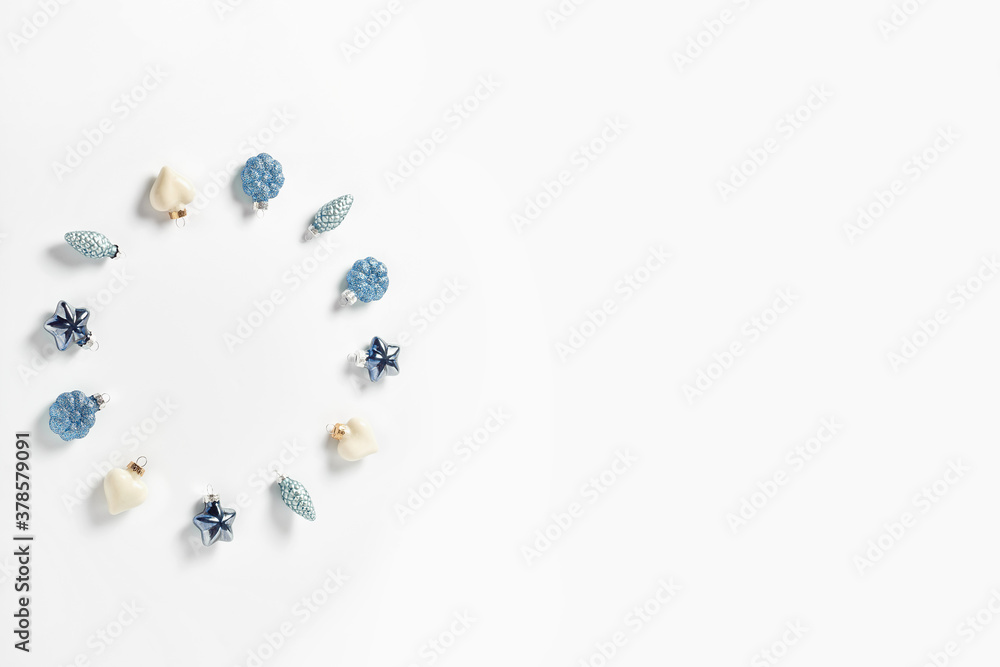 Christmas decor in the form of cones, hearts and stars in blue on a white background. minimalistic new year concept. flat lay, top view, copy space Christmas decor in the form of cones, hearts and stars in blue on a white background. minimalistic new year concept. flat lay, top view, copy space