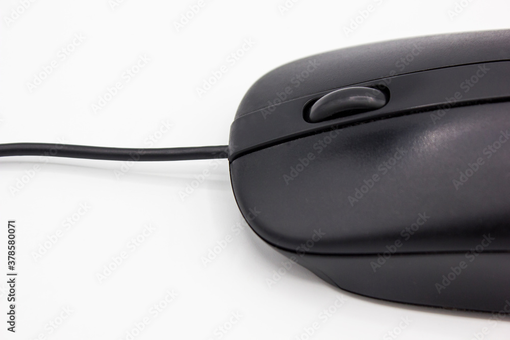 close up black computer mouse with wheel and wire on white background close up black computer mouse with wheel and wire on white background
