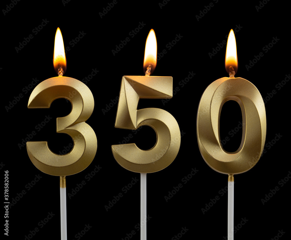 Gold birthday candles on black background, number 350 Gold birthday candles on black background, number 350