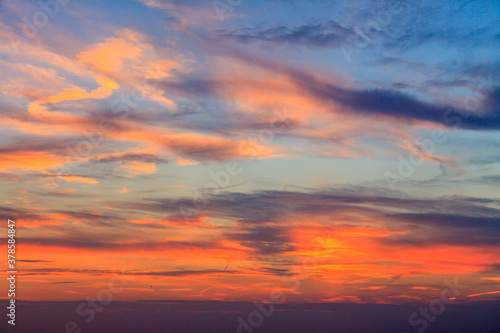 Bizarre cloud formations creating an explosion of colours at sunset  © Roel