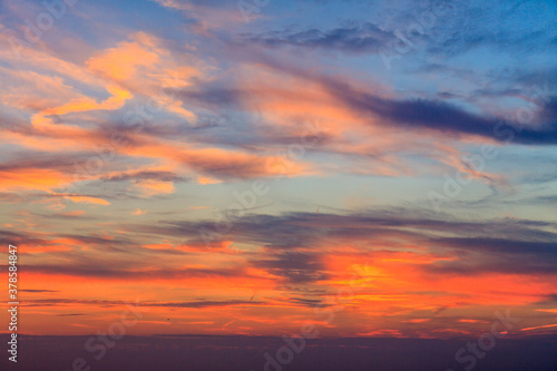 Bizarre cloud formations creating an explosion of colours at sunset 