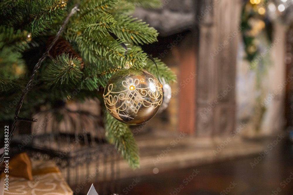 Beautiful christmas golden silver and black deco baubles on branch of christmas tree. Interior design.New Year card.Christmas decoration in gold, black and white colors. Modern New Year's scenery. Beautiful christmas golden silver and black deco baubles on branch of christmas tree. Interior design.New Year card.Christmas decoration in gold, black and white colors. Modern New Year's scenery.