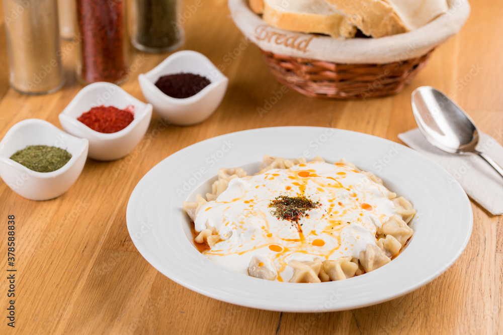 Turkish Pasty or Manti Manlama / Ravioli with yogurt and fried butter sauce. Turkish Pasty or Manti Manlama / Ravioli with yogurt and fried butter sauce.