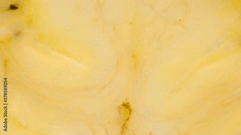 Two Banana Slices Under Pressure. The flesh of the banana is compressed and crushed close-up on a bright white background, creating a juicy splash of pulp and juice. Shooting at 120 fps Two Banana Slices Under Pressure. The flesh of the banana is compressed and crushed close-up on a bright white background, creating a juicy splash of pulp and juice. Shooting at 120 fps