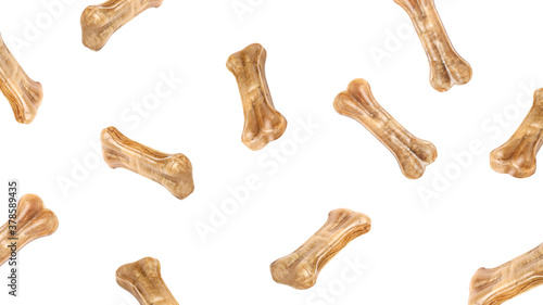 Bone-shaped dog food flying around poured in different directions on a white background.