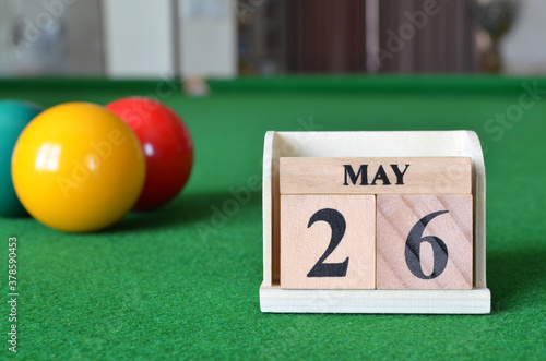 May 26, number cube with balls on snooker table, sport background. photo