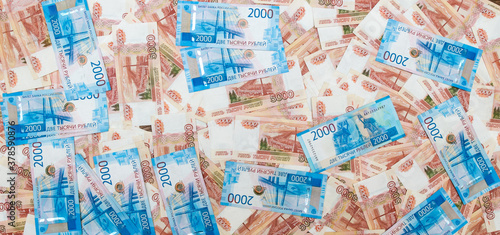 Russian money in denominations of five thousand rubles and two thousand rubles, Close-up. The concept of Finance. Background and texture of money, top view.