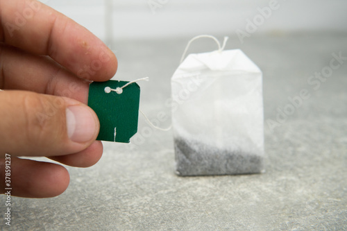 tea bag in hand