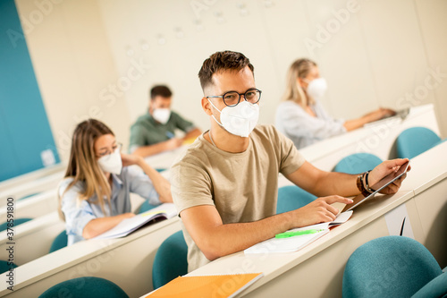 Male student wearing face p...