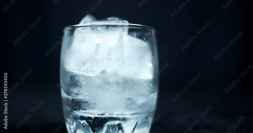 time-lapse pf melting ice cubes in a glass time-lapse pf melting ice cubes in a glass