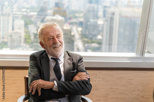 Portrait of happy businessman having meeting to success deal business at skyscraper office with cityscape business zone background