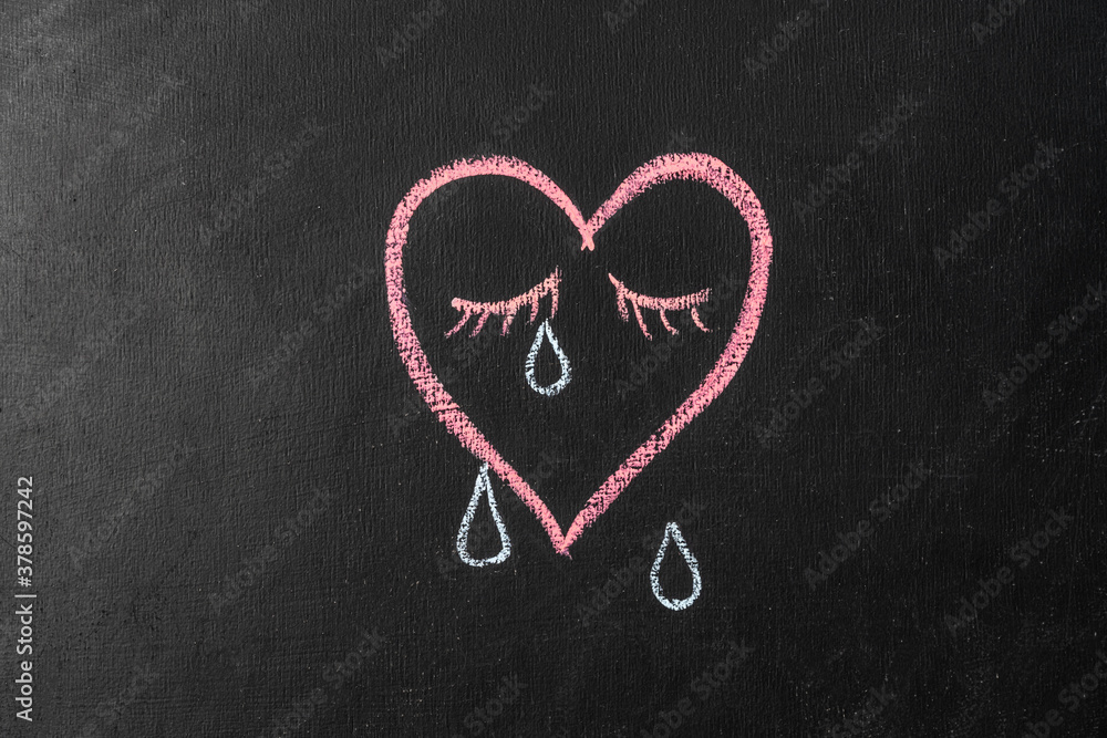 crying heart painted on chalk board