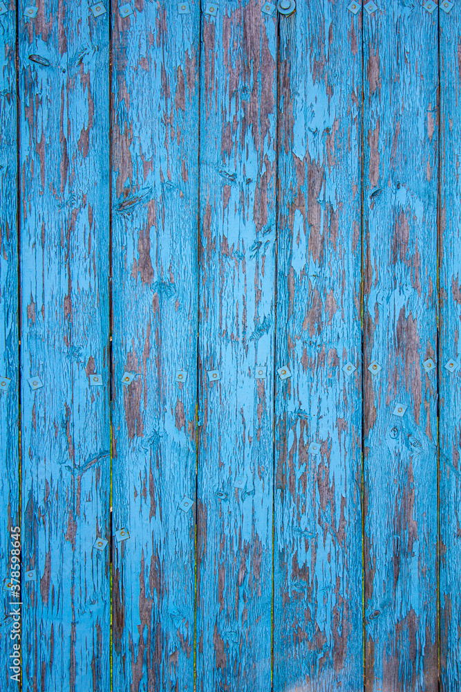 old fence with peeling blue paint old fence with peeling blue paint