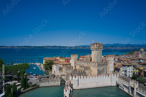 Sirmione, Lake Garda, Italy. Aerial view of Sirmione Castle. The blue water of Lake Garda in the background of blue sky