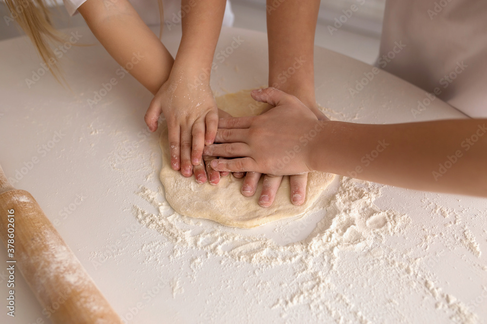 person's hands kneading dough person's hands kneading dough