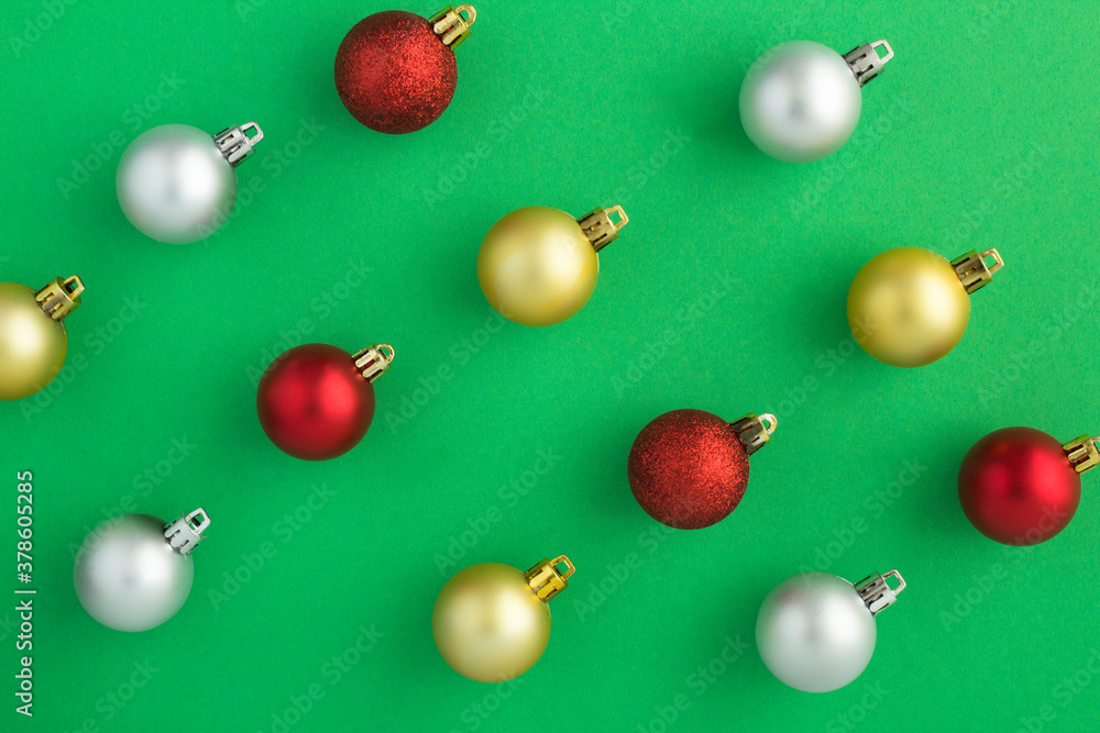 Flat lay Christmas colorful balls on the green background Flat lay Christmas colorful balls on the green background