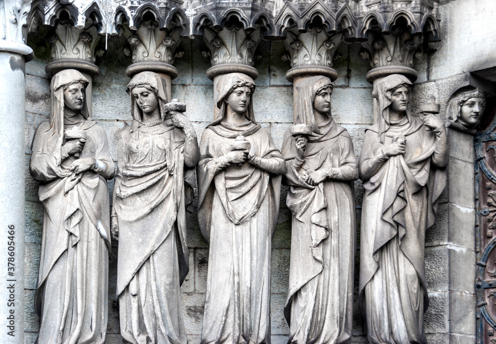 Sculptures above the portal, on the façade of St Finn Barre's Cathedral in Cork, Ireland, built in the 19th century in Gothic Revival style. Sculptures above the portal, on the façade of St Finn Barre's Cathedral in Cork, Ireland, built in the 19th century in Gothic Revival style.