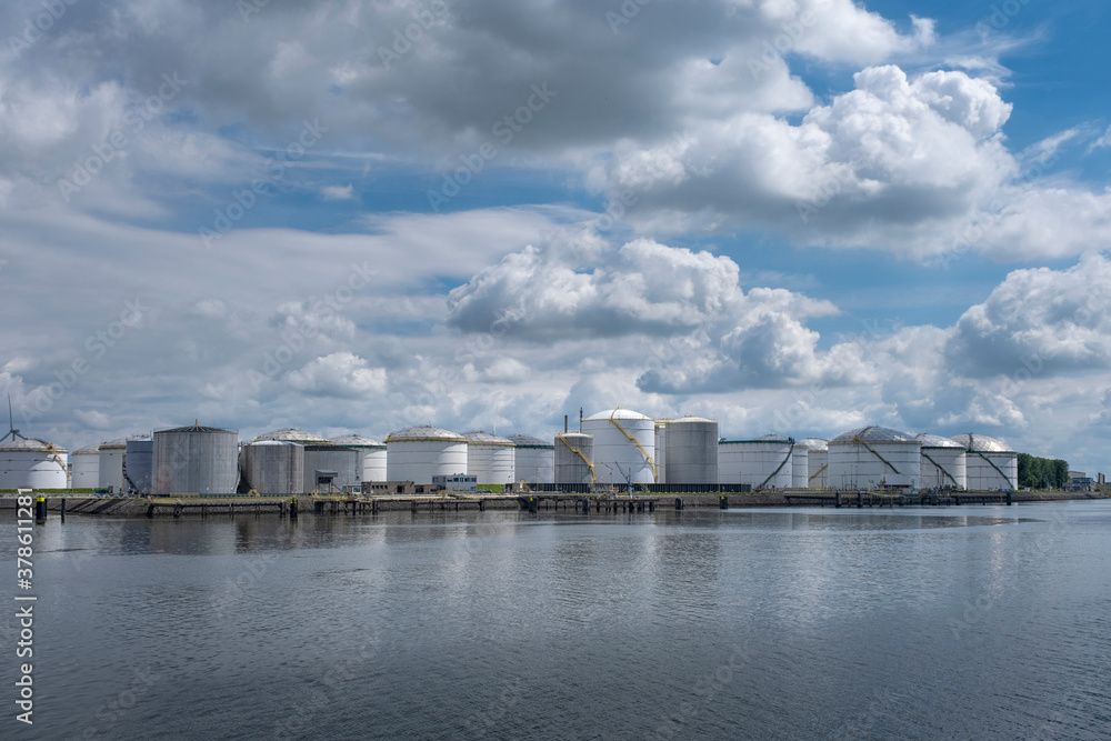 Tanker and oil storage tanks in Rotterdam, Netherlands. The port is the largest in Europe and facilitate the needs of a hinterland Tanker and oil storage tanks in Rotterdam, Netherlands. The port is the largest in Europe and facilitate the needs of a hinterland