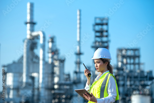 Engineer inspecting in industrial oil refinery. Industry 4.0 concept. Background blurred concept. photo