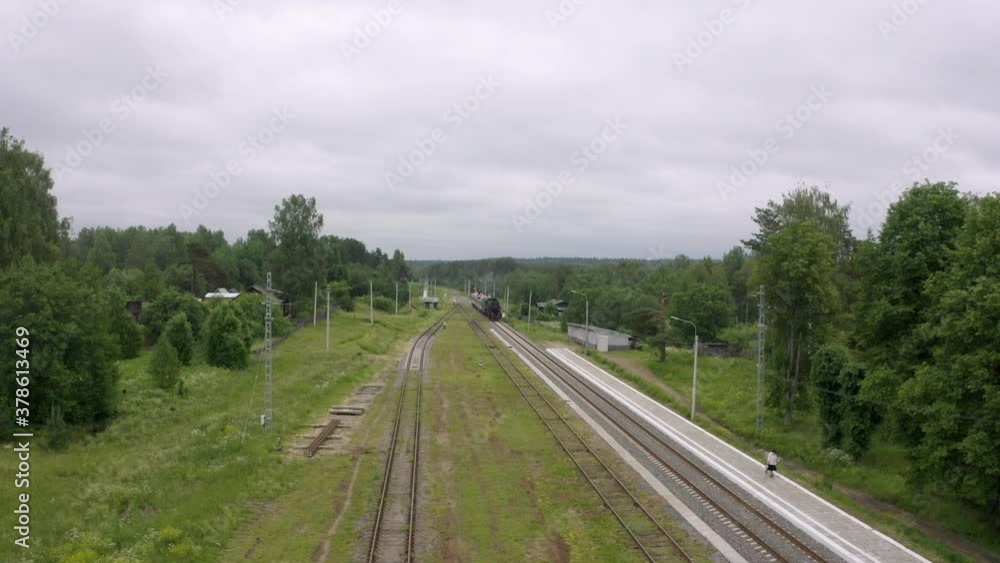 Arrival of a passenger train with a steam locomotive to the station of Kuzhenkino. Arrival of a passenger train with a steam locomotive to the station of Kuzhenkino.