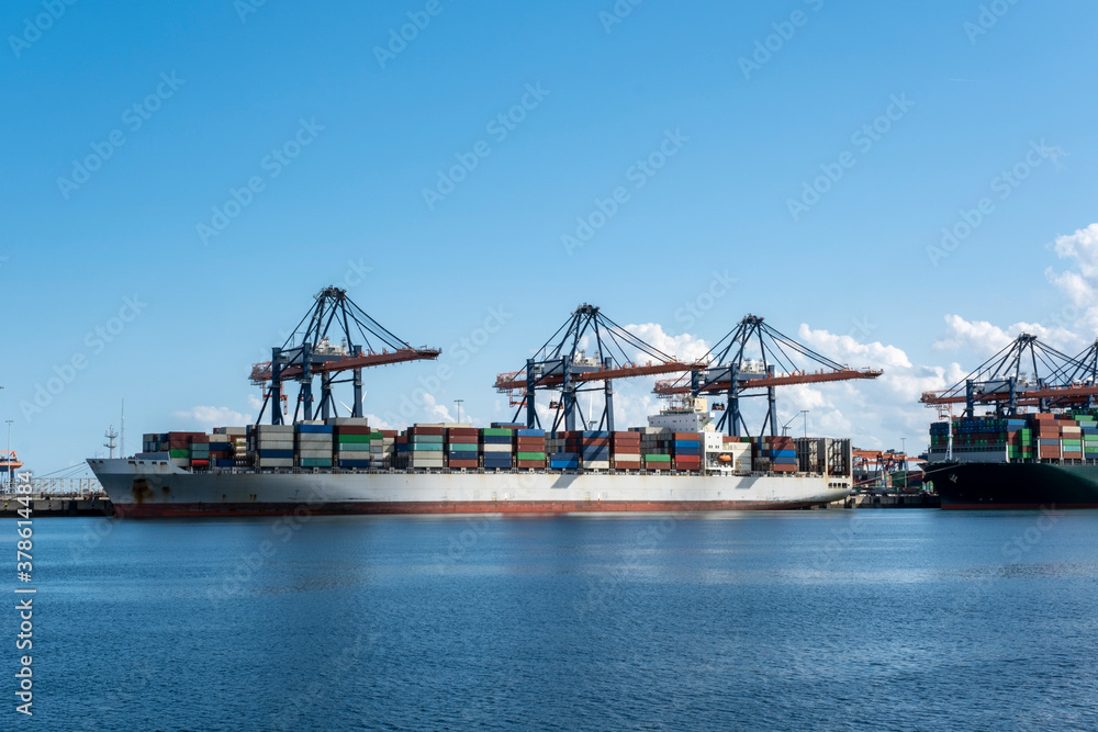 Fototapeta premium Logistics and transportation of Container Cargo ship and Cargo plane with working crane bridge in shipyard