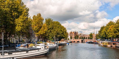 canal and boats in Amsterdam on an sunny autumn day