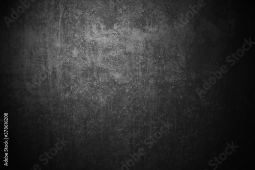 Dreckige Betonwand mit dunkler schwarz grauer Farbe als grunge Hintergrund