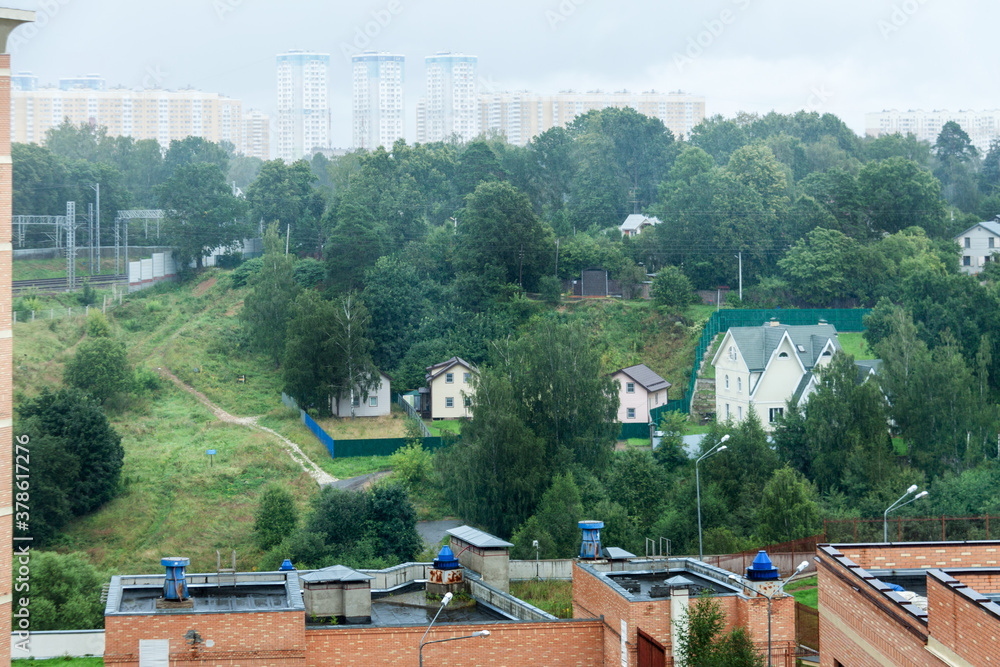 Low-rise and high-rise construction apartment building exterior in green park residential area for sale. Urban development concept image Low-rise and high-rise construction apartment building exterior in green park residential area for sale. Urban development concept image