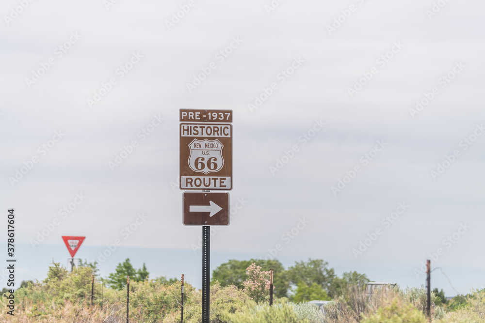 Fototapeta premium Santa Fe, USA Historic highway route 66 sign near city with pre 1937 text and arrow direction to town