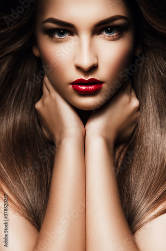 Portrait of woman with red lips and long hair