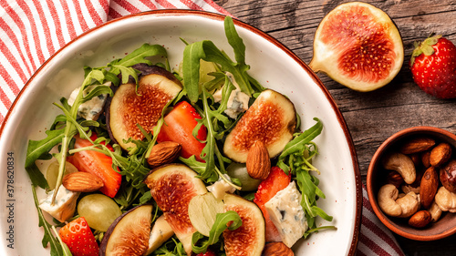 Fig, arugula and cheese salad, still life, Food recipe background. Close up