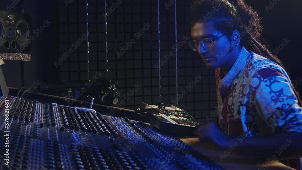 Music production. Male producer and dj. Hindi man working in the