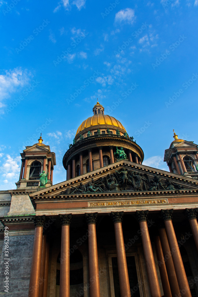 St. Petersburg, Russia. Saint Isaac's Cathedral on a blue sky background with a perspective St. Petersburg, Russia. Saint Isaac's Cathedral on a blue sky background with a perspective