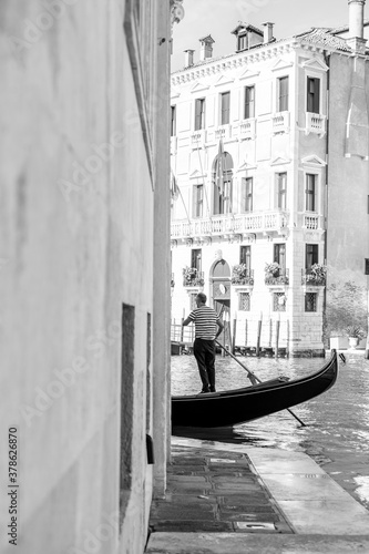 gondola driver photographed from profile in black and white