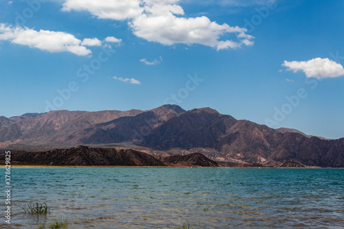 Wonderful Potrerillos Mountains in front of lake.